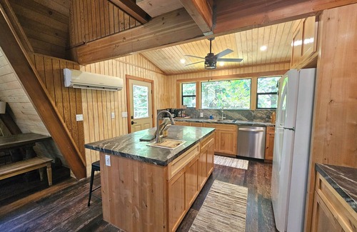 Sierra Cedars Cabin | Tucked in the trees, Cedar Hill is a cozy A-frame cabin with modern updates, a spacious kitchen, wraparound deck, and stunning views. The perfect mountain escape for families, couples, and friends—plus, it's pet-friendly!