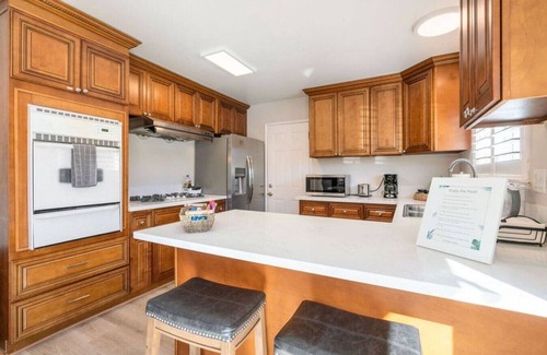 Rowland Heights House | Twilight Paradise: 4 Bedrooms, 2 Bathrooms, Private Pool, Patio Dining for 8, BBQ, and a One-of-a-Kind Indoor Fireplace.