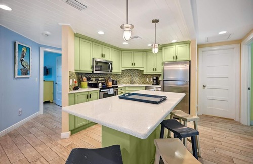 Holmes Beach Cottage | Two Bedroom Cottage with Tropical Landscaping Surrounding Private Heated Pool!