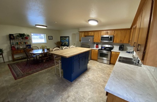 Mount Ida House | Two bedroom House with fenced in yard, covered patio area, located at the Joplin Inn at the entrance to Mountain Harbor, just 1 1/2 miles from Lake Ouachita. by RedAwning