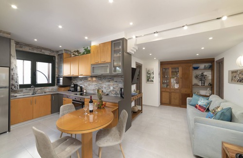 Koutsouras Condo | Two bedroom luxury condo with private patio with vineyard & BBQ near beach