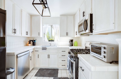Palms Apartment | Two bedroom Townhome with huge private yard, patios, laundry, & garage parking!
