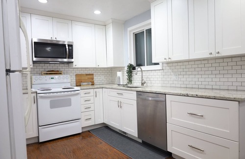 Taylorsville House | Two kitchens, patio, fenced backyard, and playground.