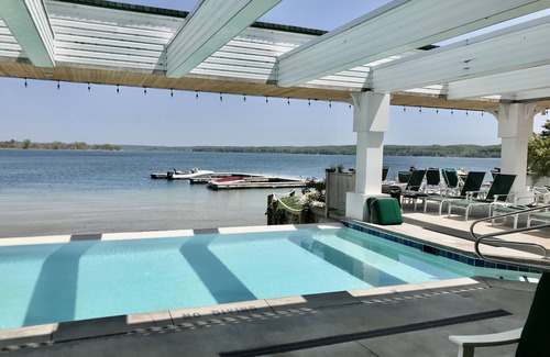 Onekama Condo | Two Lakes & Pool! 1st Floor Condo on Portage Lake and Steps from Lake Michigan