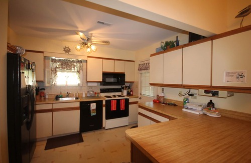 Village Green House | Two master suites makes this home a spacious vacation spot.