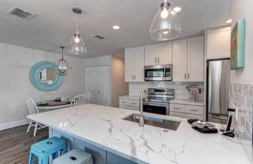 Holmes Beach House | Two minute walk to beach! PRIVATE HEATED POOL w covered lanai. Great location!