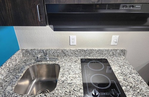 Wharton Hotel | Two Queen Beds Kitchenette Non-Smoking Room at Scottish Inns and Suites!