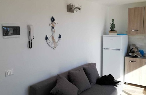 Marinella di Sarzana Apartment | Two-room apartment on the attic floor overlooking the Apuan Alps and the surrounding pine forest