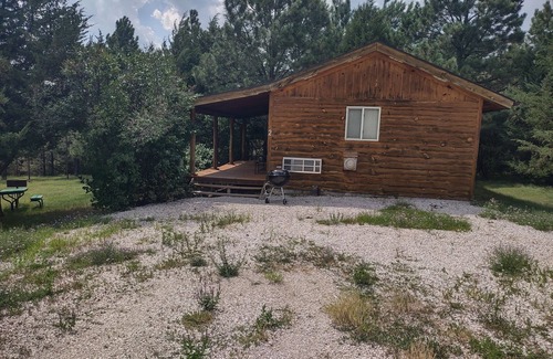 Rosebud Cabin | Two rustic cabins nestled within Rosebud Sicangu Lakota Oyate ponderosa forest.