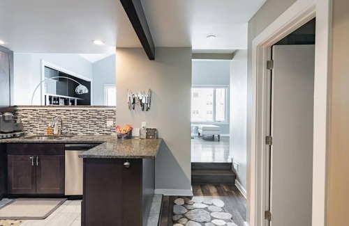 Downtown Wilmington Condo | Two-story condo in luxury townhouse. Free parking.