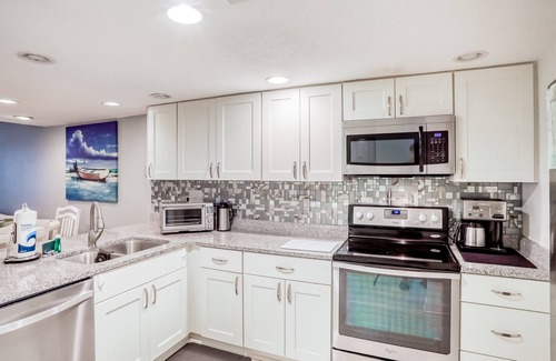 Crescent Beach Condo | Two-story condo with balcony, WiFi, W/D, AC, 2 pools, & tennis - steps to beach