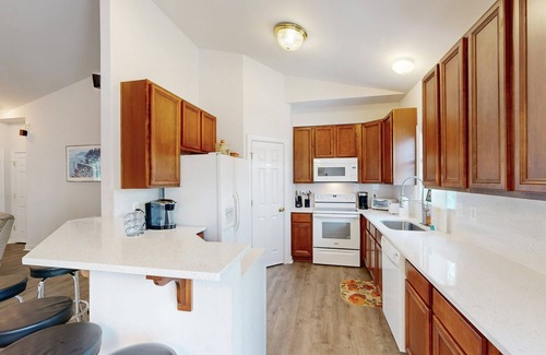 Orange House | Two-story, lakefront getaway with dock, beach, grill, 2 kayaks, 2 canoes, AC
