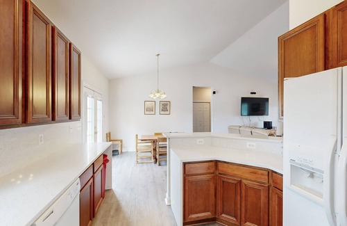 Orange House | Two-story, lakefront getaway with dock, beach, grill, 2 kayaks, 2 canoes, AC