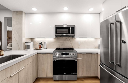 Airport Area Condo | Ultra Lux Oasis in Gated Community