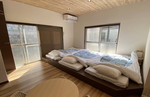 Kamiamakusa House | UmiSoraIe Beach house with garden living room / Kami Amakusa Kumamoto