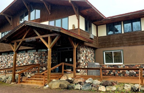 Ironwood Apartment | Unique Northern Lights Themed Guestroom inside the Lodge at North Ironwood Acres for up to Four people. 2 Queens, 2 Bathrooms. Dog Friendly resort!
