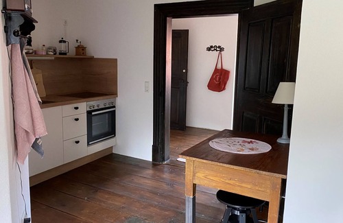Bastheim Apartment | Unique vacation apartment with a view over the monastery grounds and the romantic garden (60sqm)