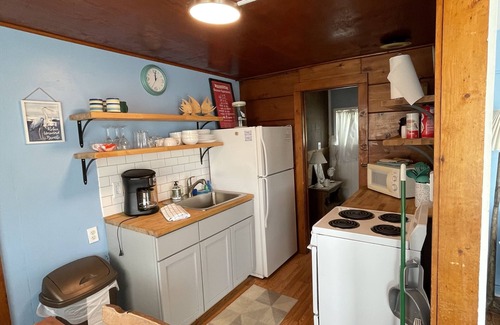 Oscoda Resort | Unit #2-The Lazy Fish one queen bed, full bathroom and renovated kitchen.