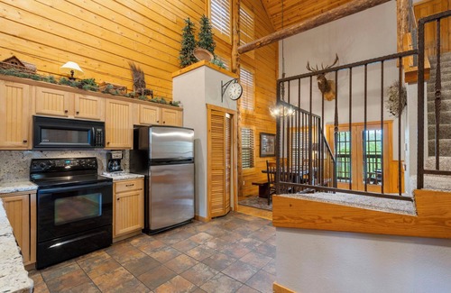 Branson Theater District Cabin | Unwind and Relax! Walk-in Log Cabin with Gas Fireplace and Screened Balcony