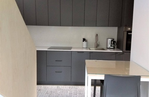 Bozeman House | Unwind in the sizeable comforts of this small modern space.