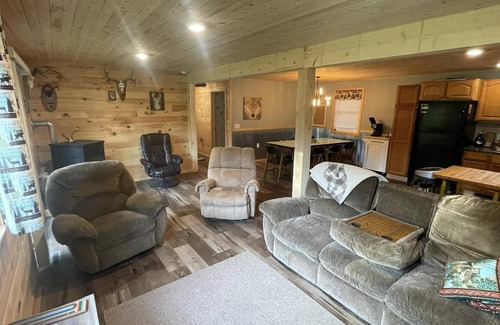 Rapid River House | UP Riverfront Cabin with rustic charm & modern amenities. Great for families!