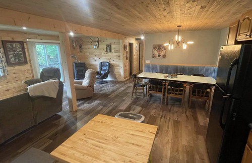 Rapid River House | UP Riverfront Cabin with rustic charm & modern amenities. Great for families!