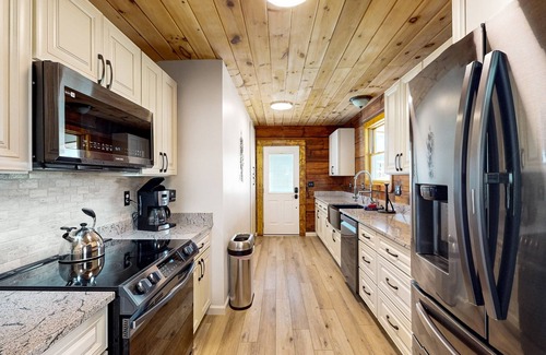 Hendersonville Cabin | Updated and peaceful home with open layout, fireplace, streaming, deck, AC