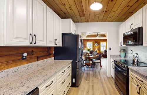 Hendersonville Cabin | Updated and peaceful home with open layout, fireplace, streaming, deck, AC