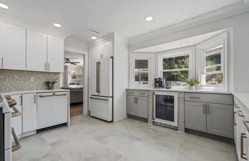Oakdale House | Updated home with canal & hot tub in backyard. Close to everything!