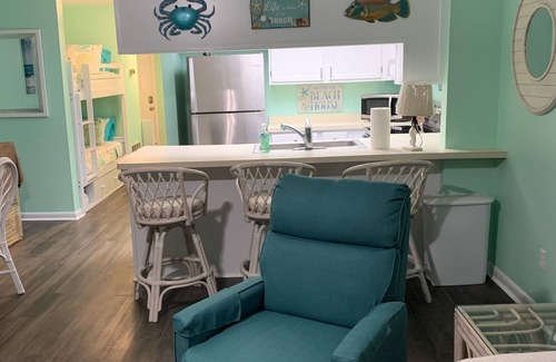 Surf City Condo | Updated in 25! 1 minute walk to Beach & Pool! 1 Bedroom + Bunk Beds. 10.0 Rated!