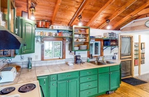 Charlotte Cottage | Updated lakefront home in a wooded setting with private dock & beach access