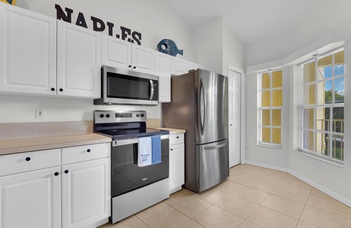 Ole Condo | Updated modern 3rd floor Lely Resort condo overlooking tropical preserve!