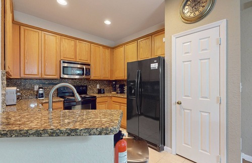 Trafalgar Village House | Updated retreat with pool access, W/D, AC, & patio - close to Disney Parks
