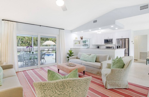 Beau Rivage West House | Updated Stuart home in waterfront community with private backyard, pool & lanai