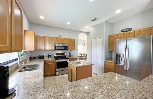 Four Corners House | Upgraded pool home with hot tub and games/movie room - gated resort 6 miles from Disney!