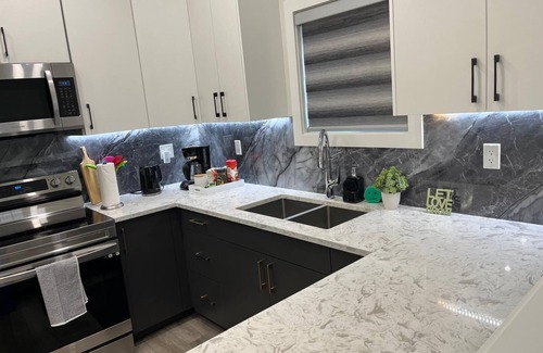 St. James Apartment | Upper Suite Family Haven - 6 minutes drive from the Airport, Close to Everything