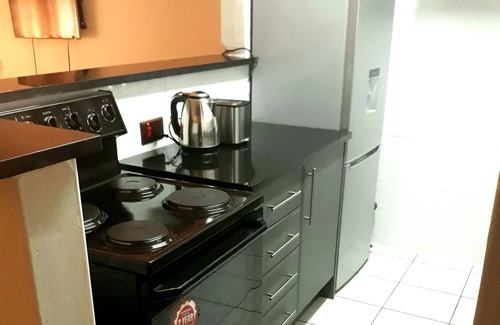 Harare Apartment | Upscale and Urban Warm Tasteful 1 Bed Apartment.