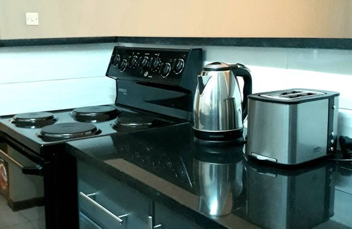 Harare Apartment | Upscale and Urban Warm Tasteful 1 Bed Apartment.