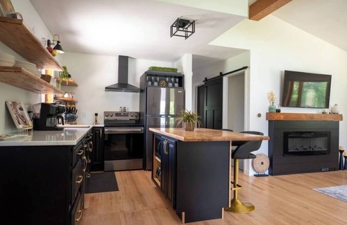 Decorah House | Urban Edge | Comfort & Fun: Large Game Room & Fitness Room