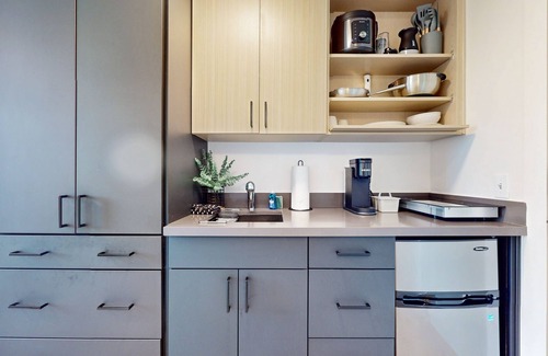 Old Ballard Apartment | Urban studio unit with patio views, shared lounge space and dedicated workspace