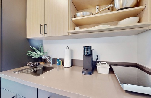 Old Ballard Apartment | Urban studio unit with patio views, shared lounge space and dedicated workspace