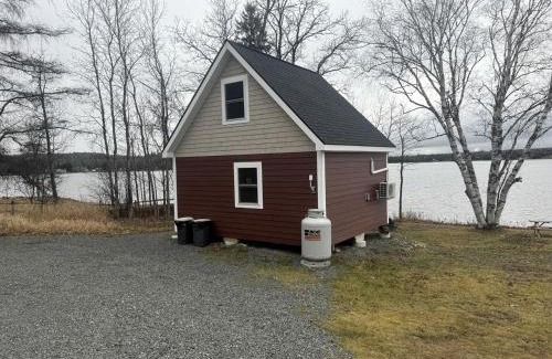 Portage Lake House | Magnificent Cabin Nestled Amidst Trees in Portage Lake, Maine