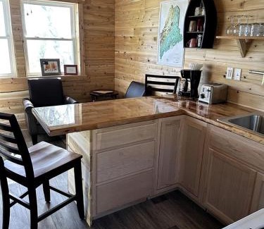Portage Lake House | Magnificent Cabin Nestled Amidst Trees in Portage Lake, Maine