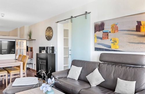 Wremen Apartment | Vacation apartment near the beach with sauna and great, covered balcony with dyke view