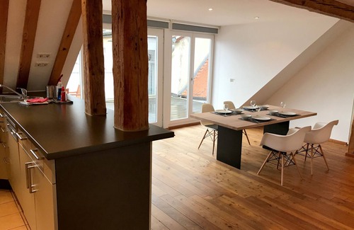 Insel Apartment | Vacation apartment with lake view - maisonette with roof terrace in the old town house on the island