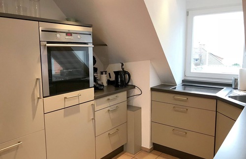 Insel Apartment | Vacation apartment with lake view - maisonette with roof terrace in the old town house on the island