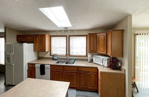 Tawas City House | Vacation Delight-Two blocks from boat launch, park, beach and popular Newman St.