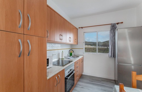 Moya Apartment | Vacation 'Los Adejo' with Shared Terrace, Shared Garden and Wi-Fi