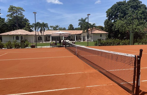 Survey Creek House | Vacation Tennis House with Euro Red Clay Tennis Court! Discounted Summer Rates!