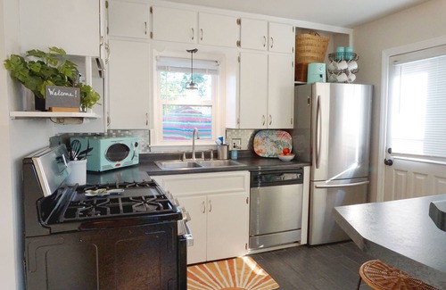 Cedar Rapids House | Vibrant Getaway! 2 Baths + Walk in Shower, Great Amenities & Value